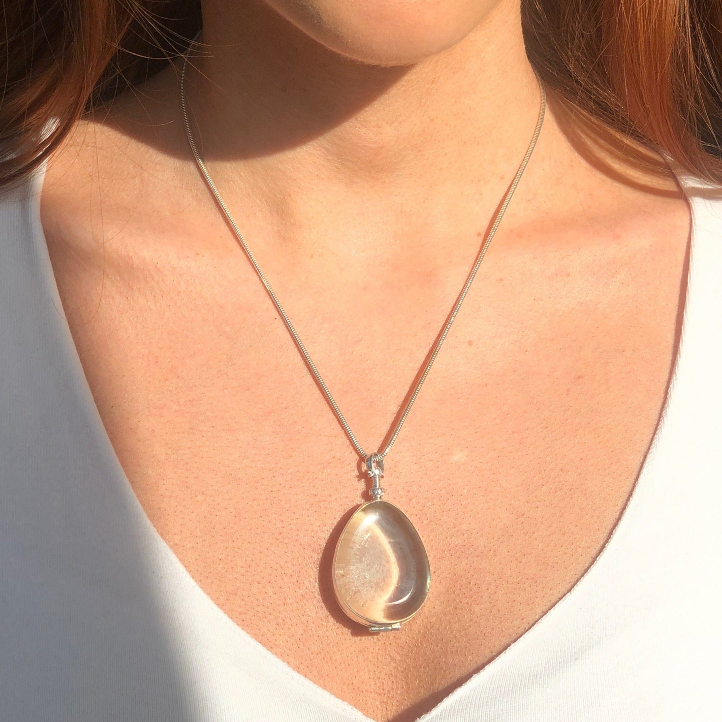 large teardrop sterling silver locket on silver snake chain