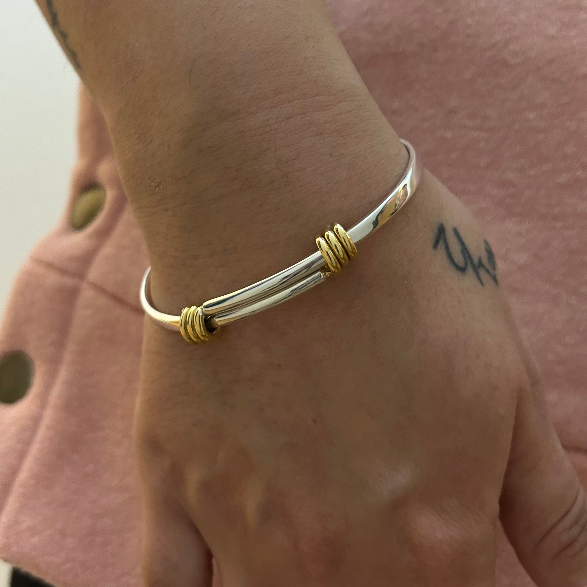 Silver and 2025 gold bangle bracelet