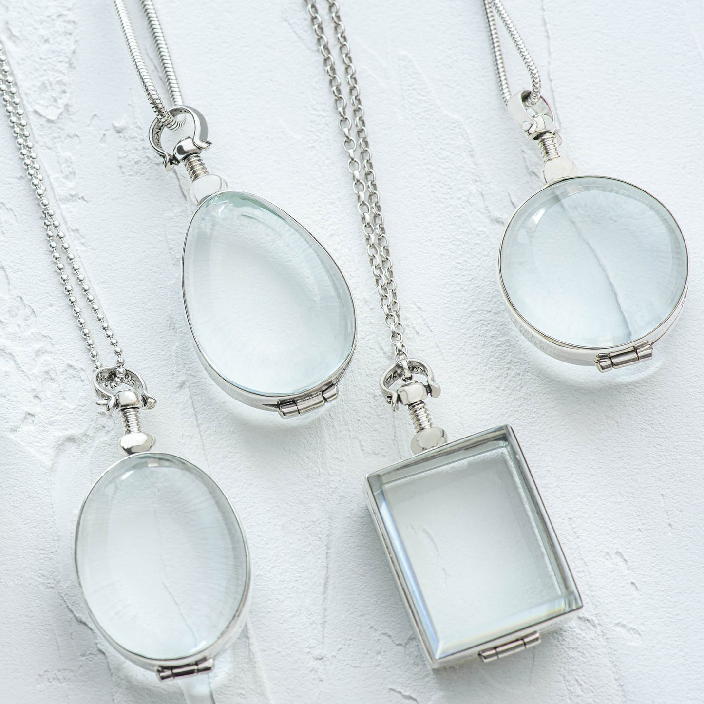 medium deep lockets in teardrop, oval, round and rectangle shapes